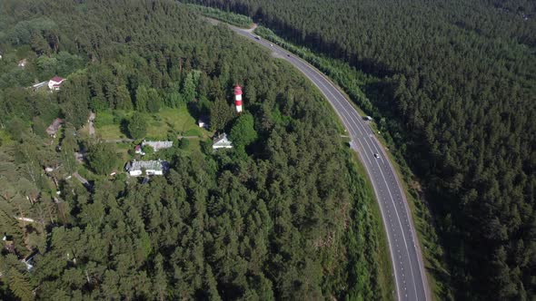 Flight to the Lighthouse Over the Road and Forest