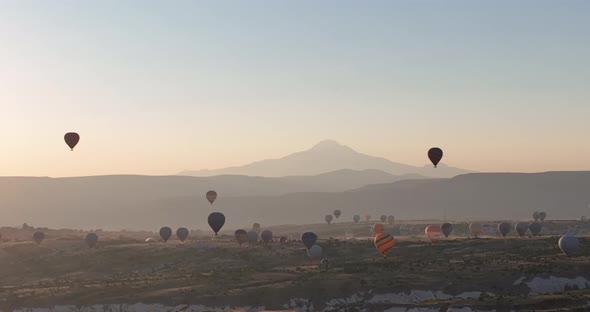 Aerial Cinematic Drone View of Colorful Hot Air Balloon Flying Over Cappadocia