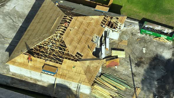 Aerial View of Suburban Private House Wit Wooden Roof Frame Under Construction in Florida Quiet