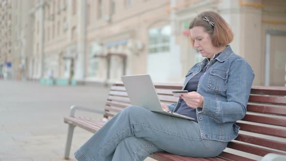 Old Woman Making Online Payment Failure on Laptop in Office