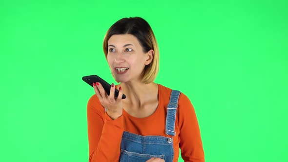 Girl Asks for Information on the Network Via Phone on Green Screen