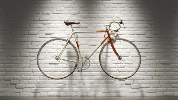 Bicycle isolated on the white brick wall. Retro, old-fashioned bike. Recreation.