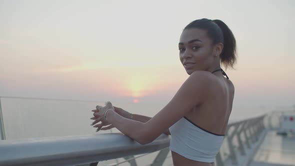 Lovely African Woman Enjoying Cityscape at Sunrise