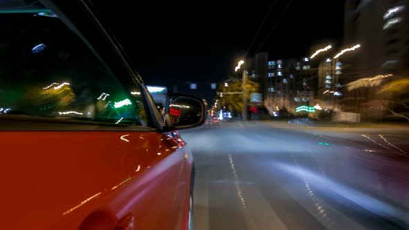 Drivelapse From Side of Car Moving on a Night Avenue in City Timelapse Hyperlapse