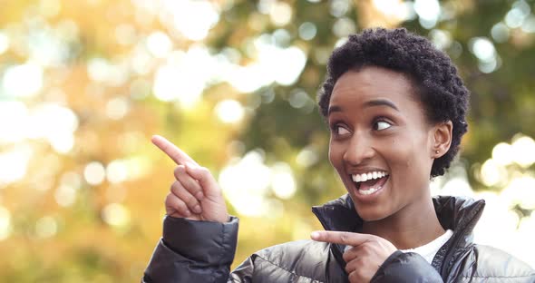 Afro American Girl Showing with Two Index Fingers Direction To Right Side Pointing Way Black Woman