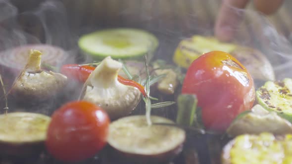 Turning Vegetable Pieces on Hot Grill