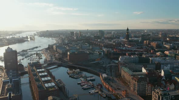 Aerial Ascending View of Hamburg Port with Boats on River Elbe and Apartment Buildings on the River