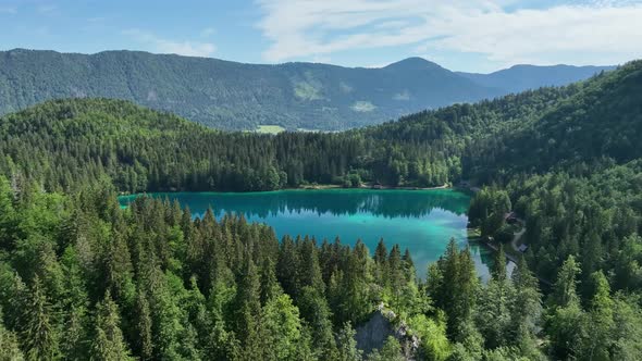 Emerald lake at Fusine with Mangart mountain