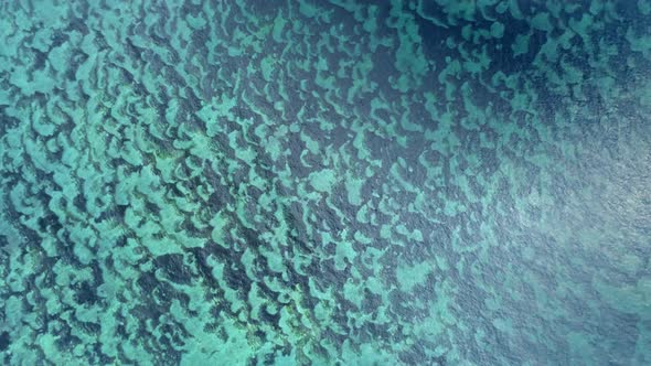 Aerial View Of The Bottom Relief Under A Crystal Clear Ocean