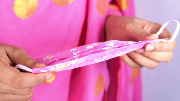 Women Hand Holding Homemade Face Mask, Close Up 