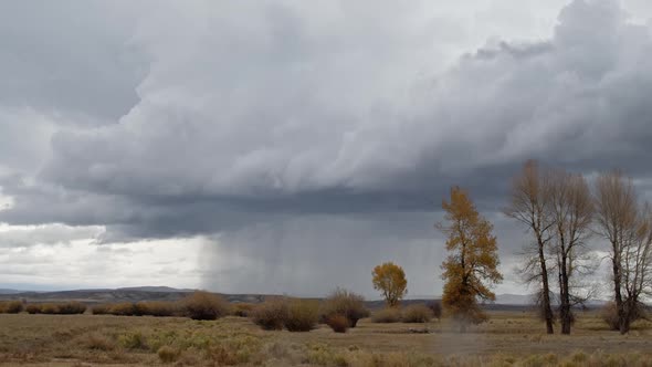 Time lapse of rain storm growing and moving over the landscape