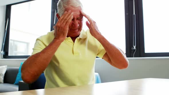 Senior man having headache