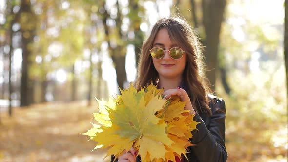 Beautiful teenage girl taking Selfie on smartphone outdoors in Park on Sunny autumn day