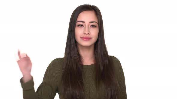 Closeup Portrait of Candid Female with Full Lips with Smile Gesturing on Camera with OK Sign