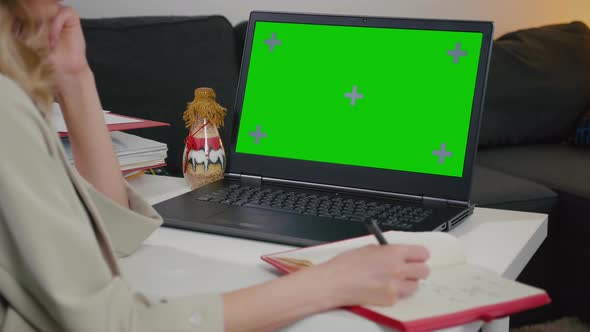 Close-up of Green Screen with Color Laptop Display.