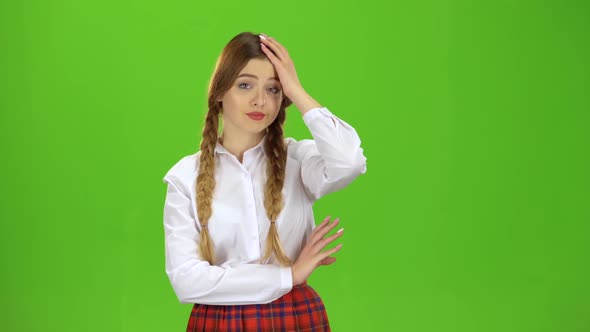 Girl Student with Two Pigtails Tired . Green Screen