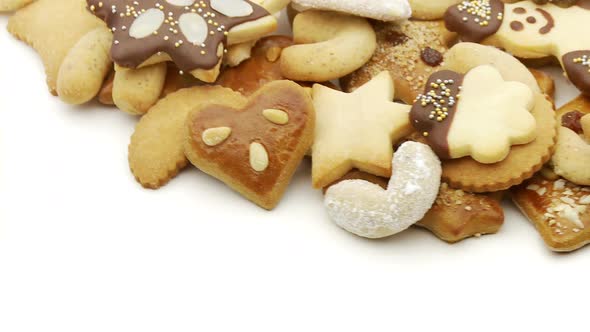 Different Christmas Biscuits on White Looping