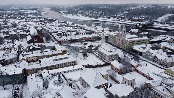 Aerial shot flying towards Kaunas City hall in winter season