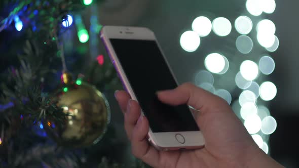 Use Smartphone On Christmas Tree Background