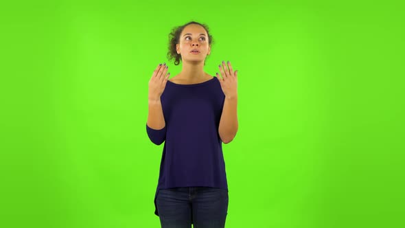 Curly Woman Cooling Herself By Her Hand, Suffering From High Temperature Weather. Green Screen