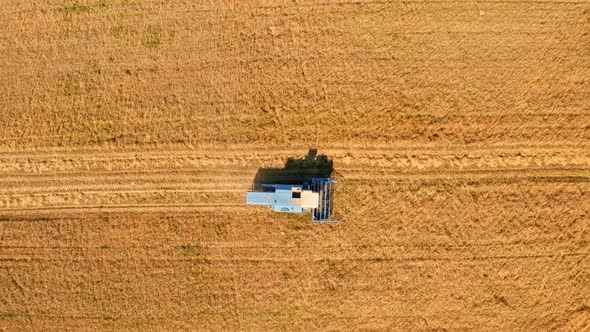 Combine working on field. Agriculture, Poland. Aerial view of nature.