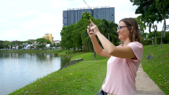 Cute Female Using Smartphone Take Picture for Social Networks