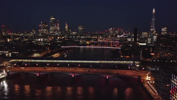 Forwards Fly Above Thames River at Night