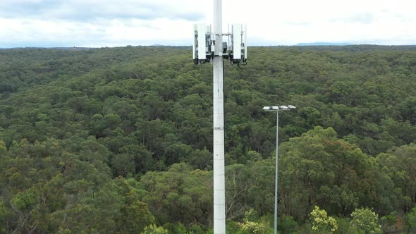 Aerial footage of a telecommunications tower from bottom to top