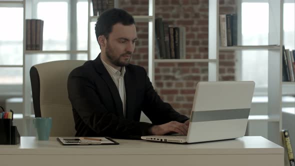 Handsome Businessman at Office Close Notebook, Stop Working