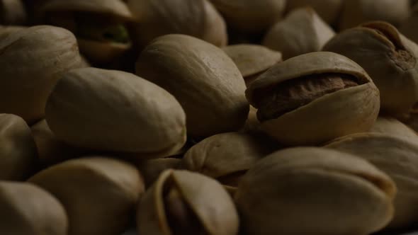 Cinematic, rotating shot of pistachios on a white surface - PISTACHIOS 042