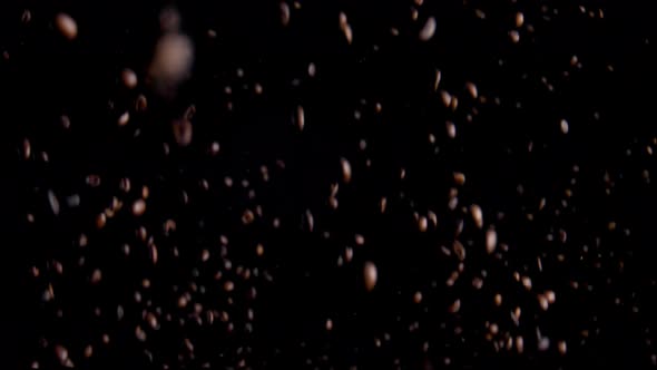 Magic Flying Coffee Beans on Black Background