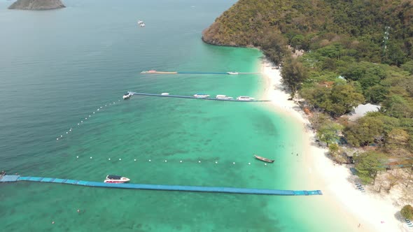 Floating mooring piers standing on the shoreline of Koh Hey (Coral Island), Thailand 