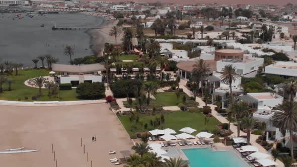 Aerial Shot of Luxury Embankment with Palms Pools Rich Houses Expensive Villas