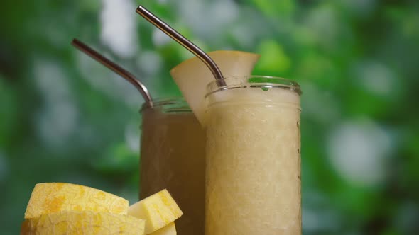 Female Hand with a Glass of Melon Juice