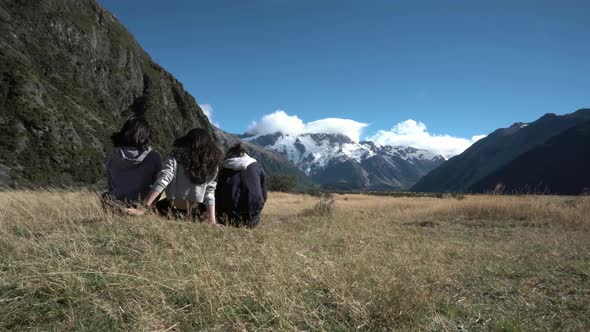 Asian Ladies Chilling On The Field And Enjoying The View 