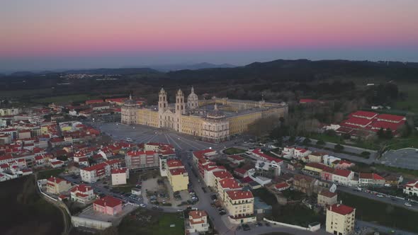 Mafra city drone aerial view at sunset with iconic Palace, in Portugal