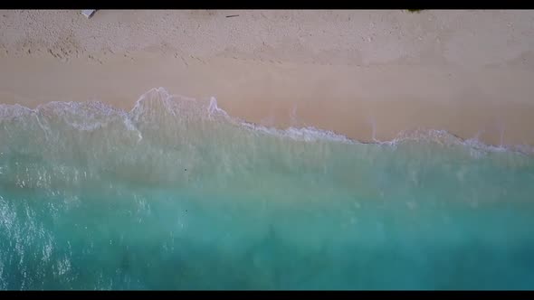 Aerial drone shot landscape of paradise bay beach break by blue green lagoon with white sandy backgr