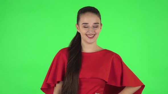 Portrait of Pretty Young Woman Is Proud of Himself. Green Screen