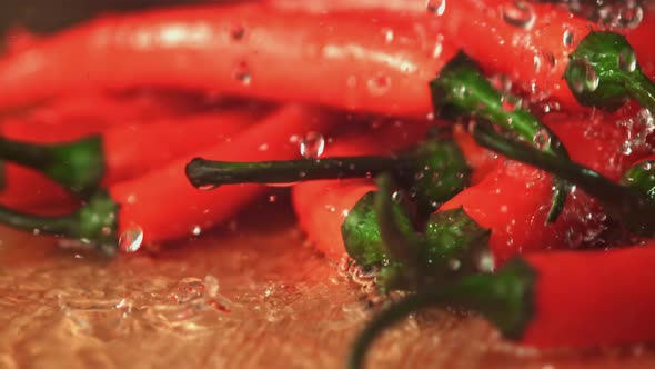 Super Slow Motion on the Chilli Pepper Fall Drops of Water