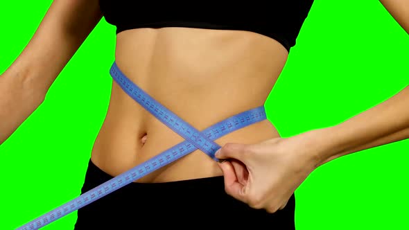 Fitness Woman Taking Body Measurements, Sportswear. Details, Green Screen