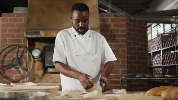 Animation of african american male baker preparing sourdough for bread