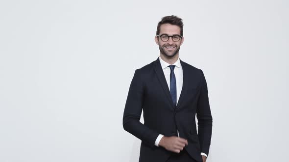 Businessman Putting On Glasses