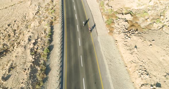 Aerial view of two person on bicycle, Mizpe Ramon, Israel.