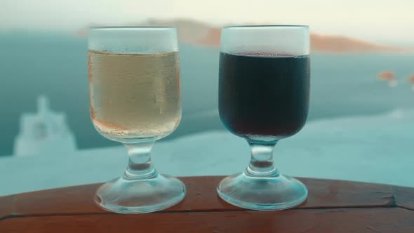 Slider Shot of Two Glasses with Wine in a Mediterranean Island