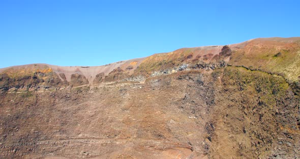 Tilting down the huge crater and cliff of the Mount Vesuvius volcano near Pompeii, Italy.
