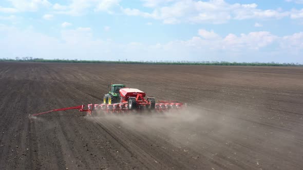 Working At The Field Tractor With The Seeder 12