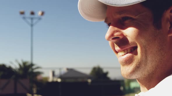 Man playing tennis on a sunny day