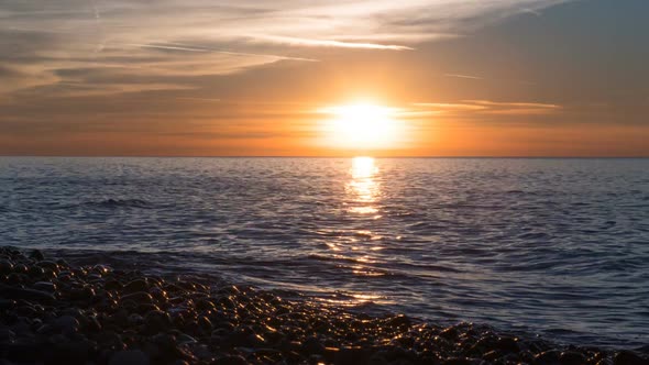 Beautiful Sunset Over the Sea in the Clouds. Time Lapse