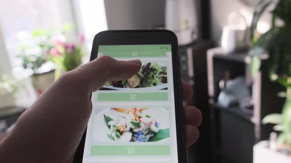 Ordering Food From Restaurant Online Using Smartphone App Close Up