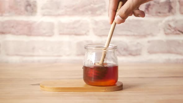 Close Up of Fresh Honey with Spoon on Table